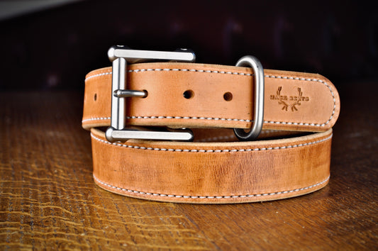 Close-up view of a premium Mack leather belt with a sturdy metal buckle, exemplifying the quality and craftsmanship that professionals prefer